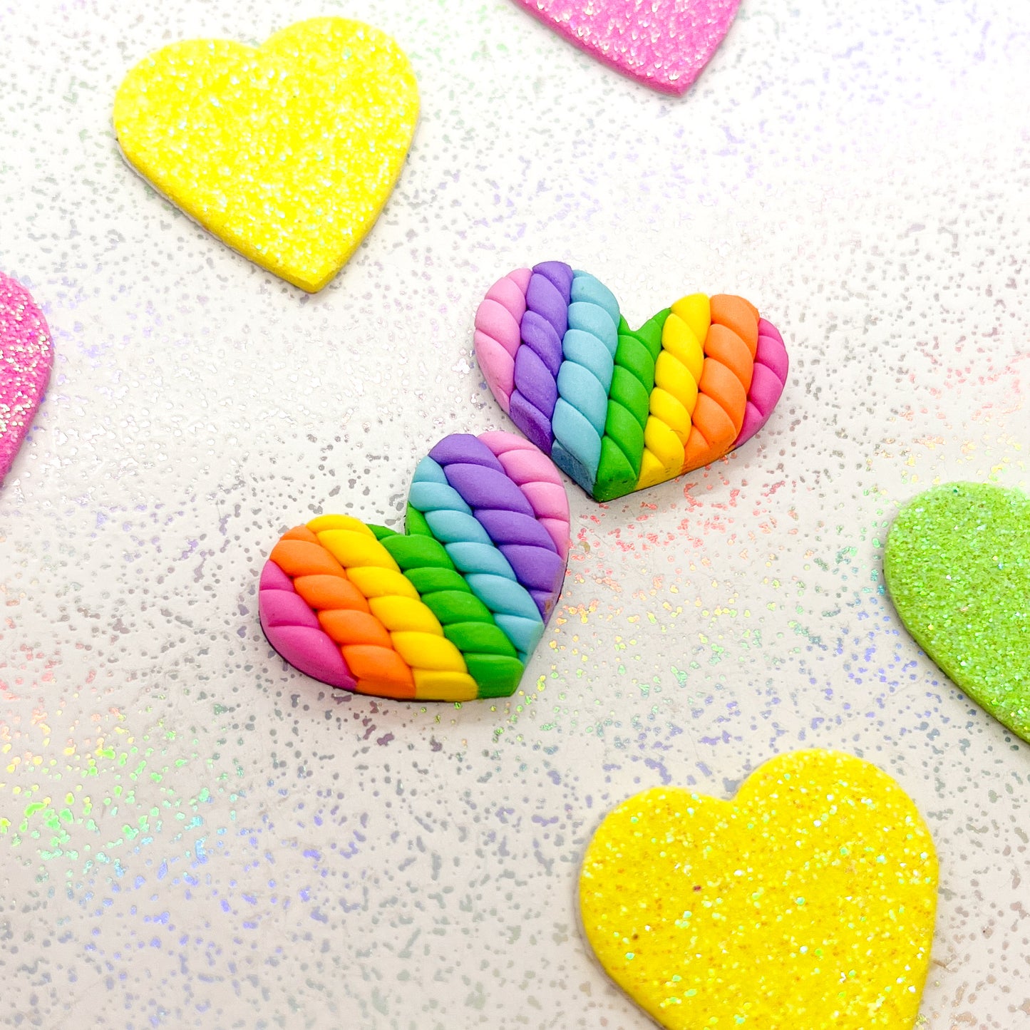 Vivid rainbow twisted heart studs