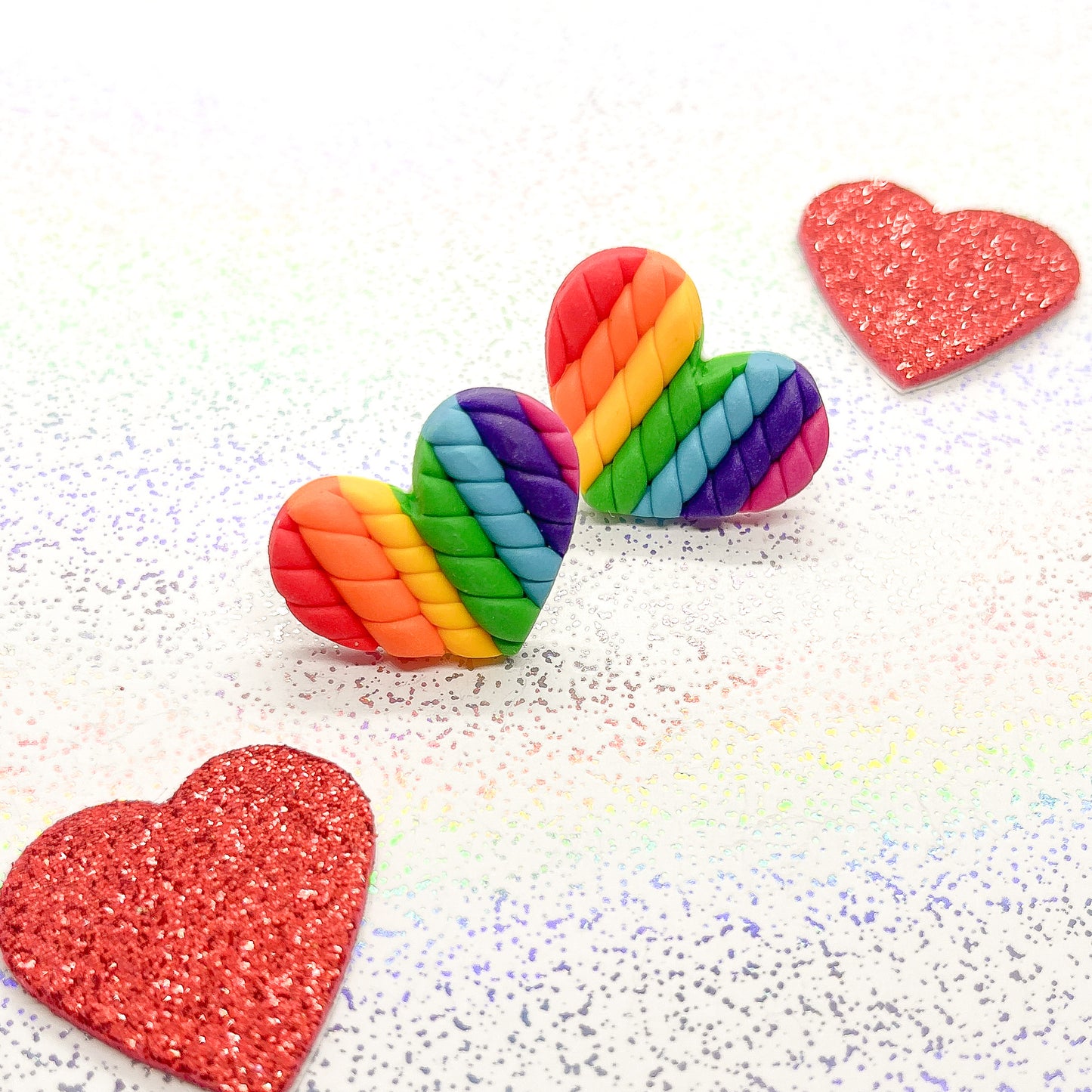 Bright rainbow twisted heart studs