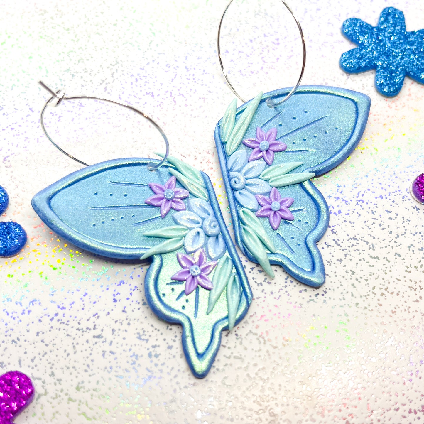 Iridescent blue fairy wing earrings