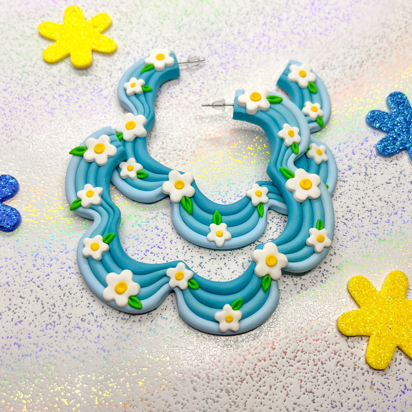 Blue ombre squiggle hoops with daisy details