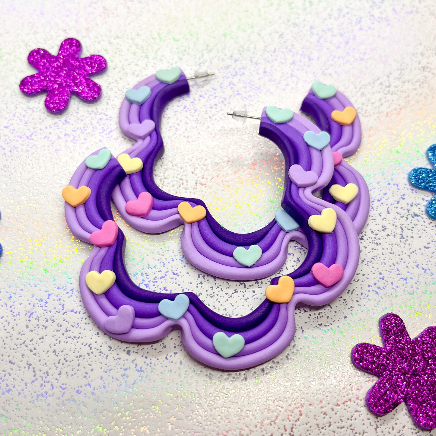 Purple ombre squiggle hoops with rainbow heart details