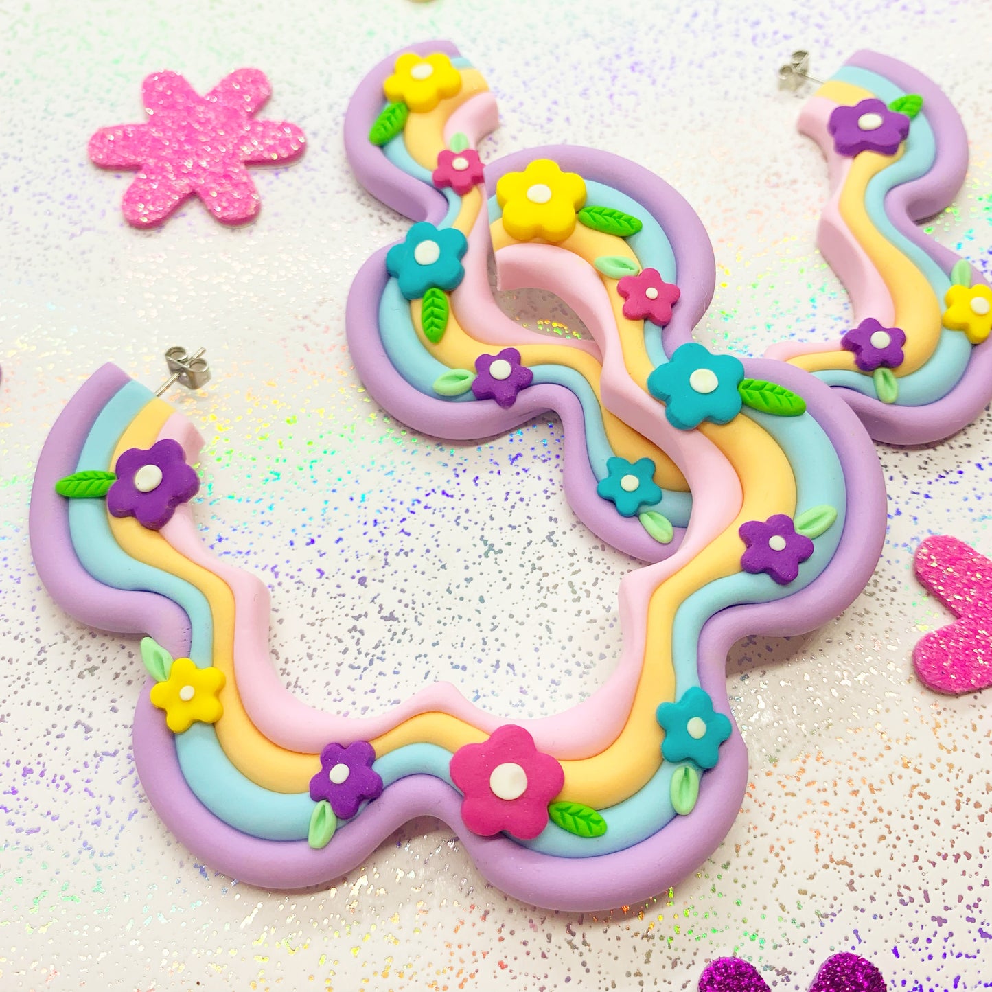 Multicoloured squiggle hoops with flower details