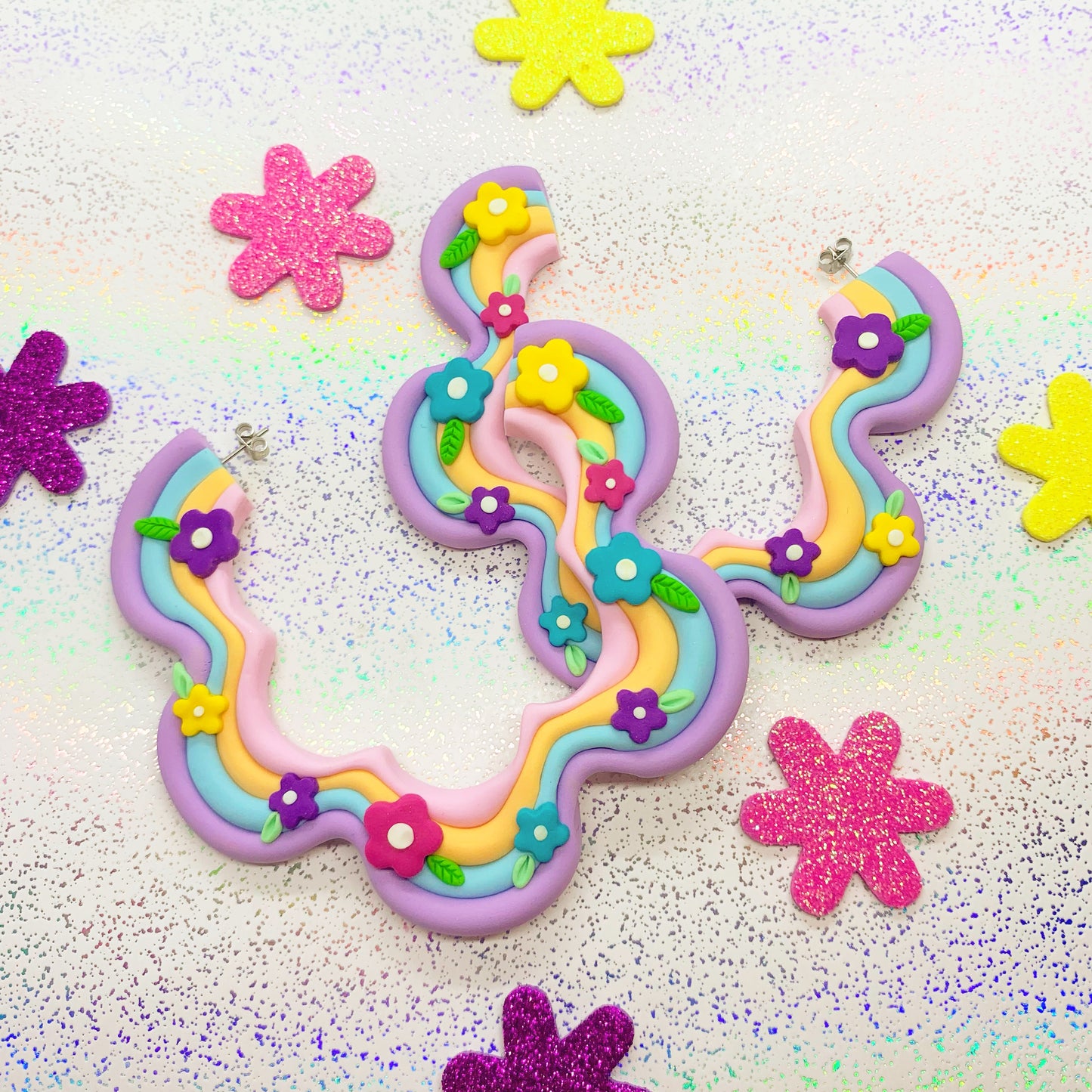 Multicoloured squiggle hoops with flower details