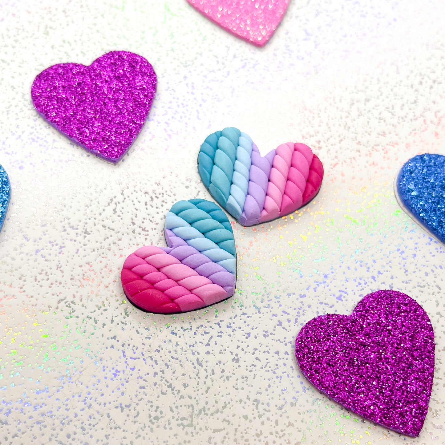 Blue to pink ombre twisted heart studs