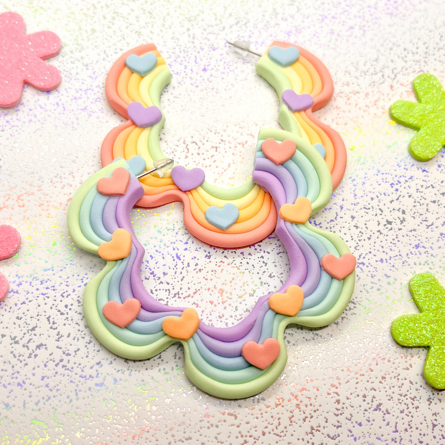 Mismatched rainbow ombre squiggle hoops with rainbow heart details