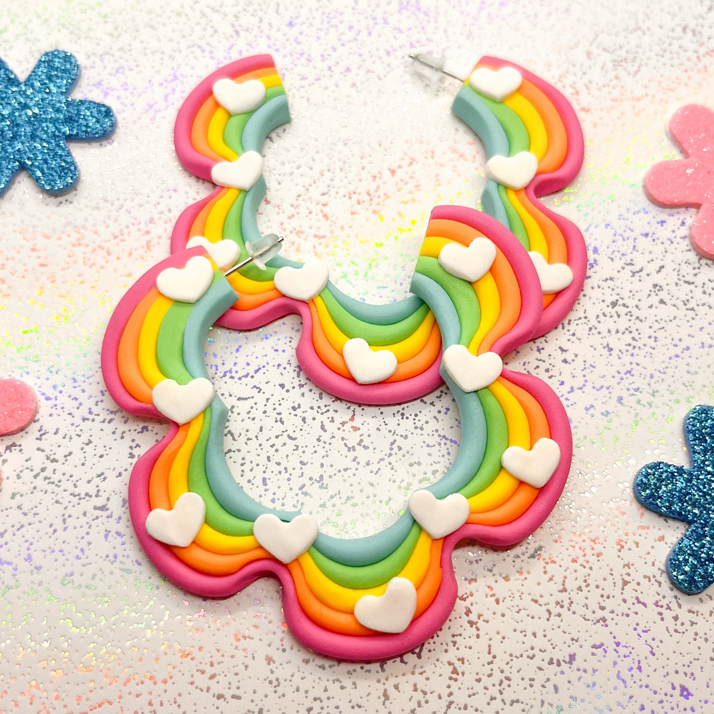 Soft rainbow mini squiggle hoops with white heart details