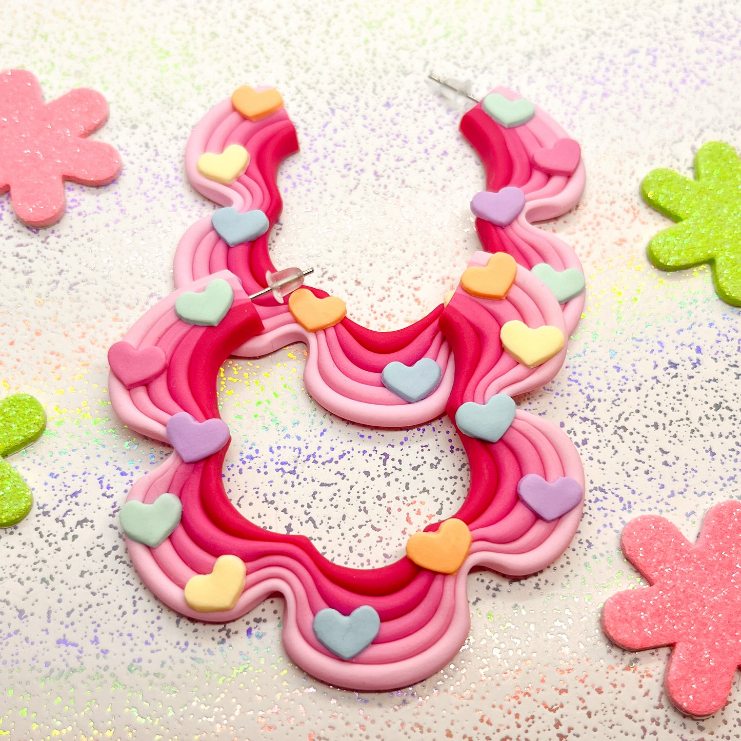 Mini pink ombre squiggle hoops with rainbow heart details