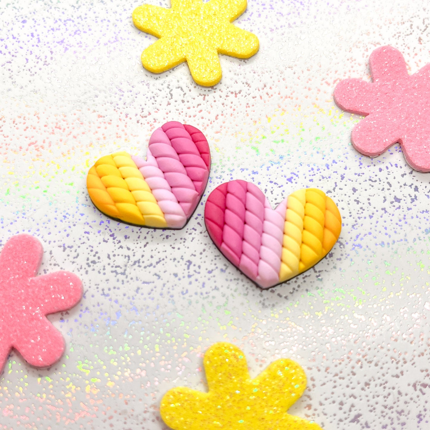 Pink to yellow ombre twisted heart studs