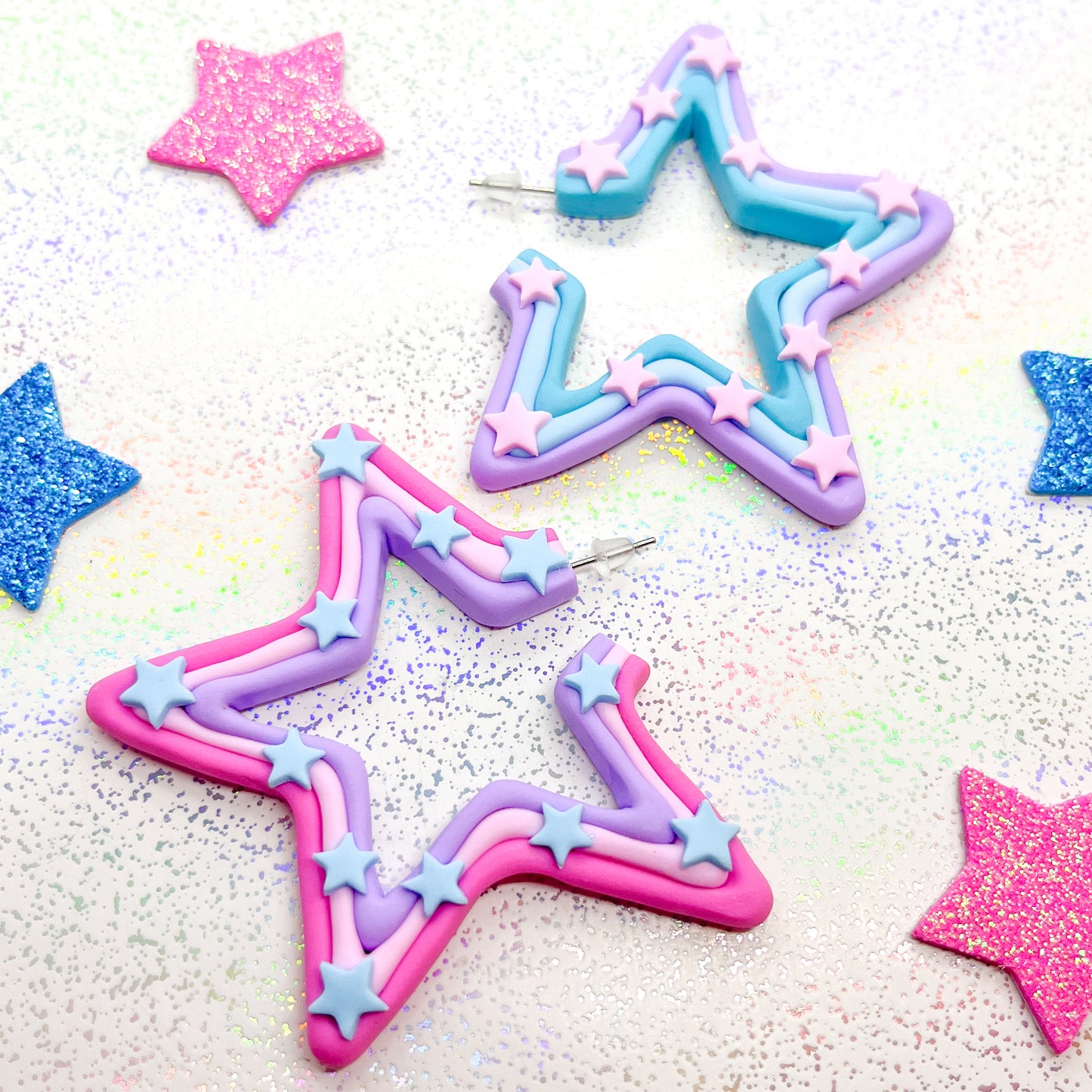 Mismatched pink and blue ombre star hoops