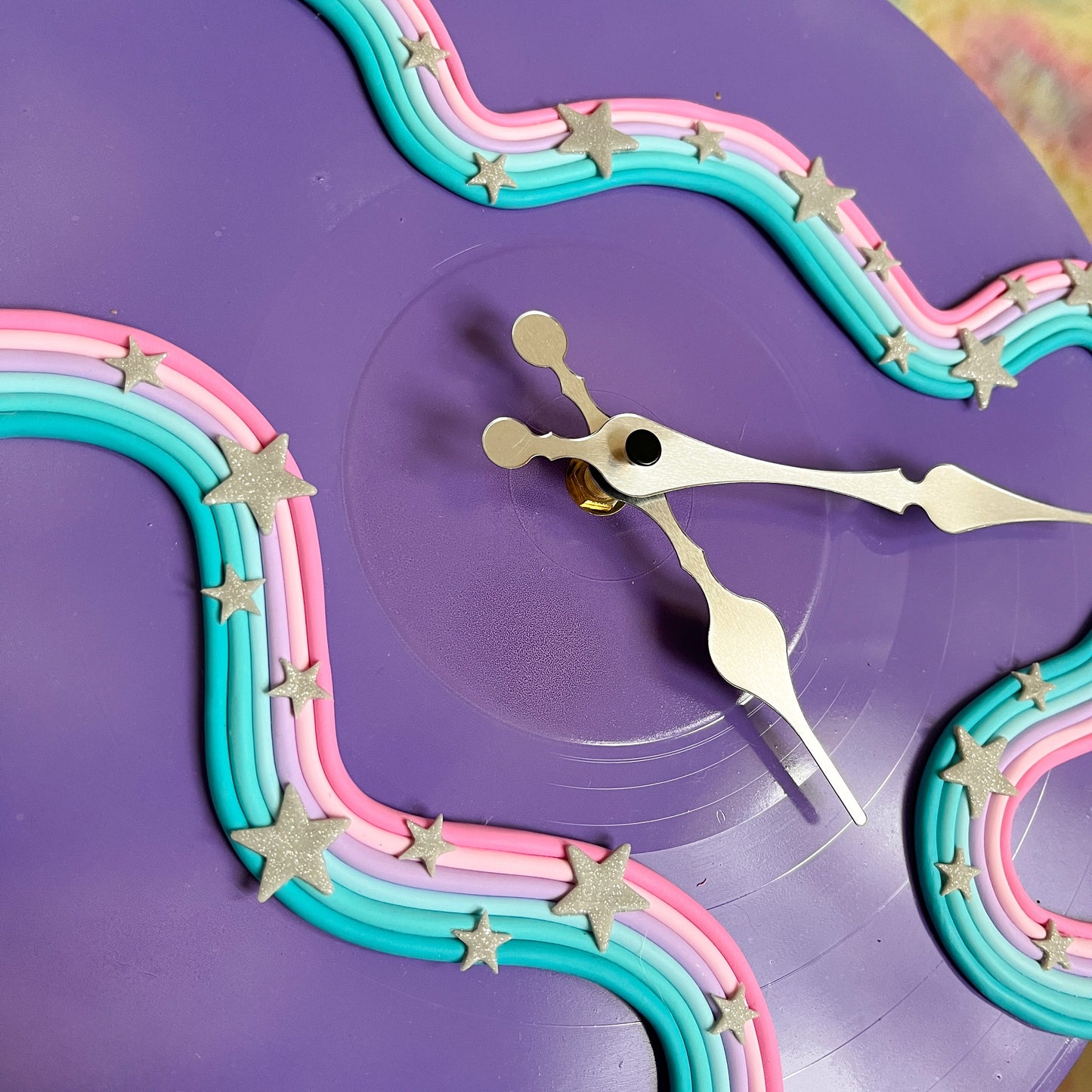 Vivid violet celestial squiggle wall clock