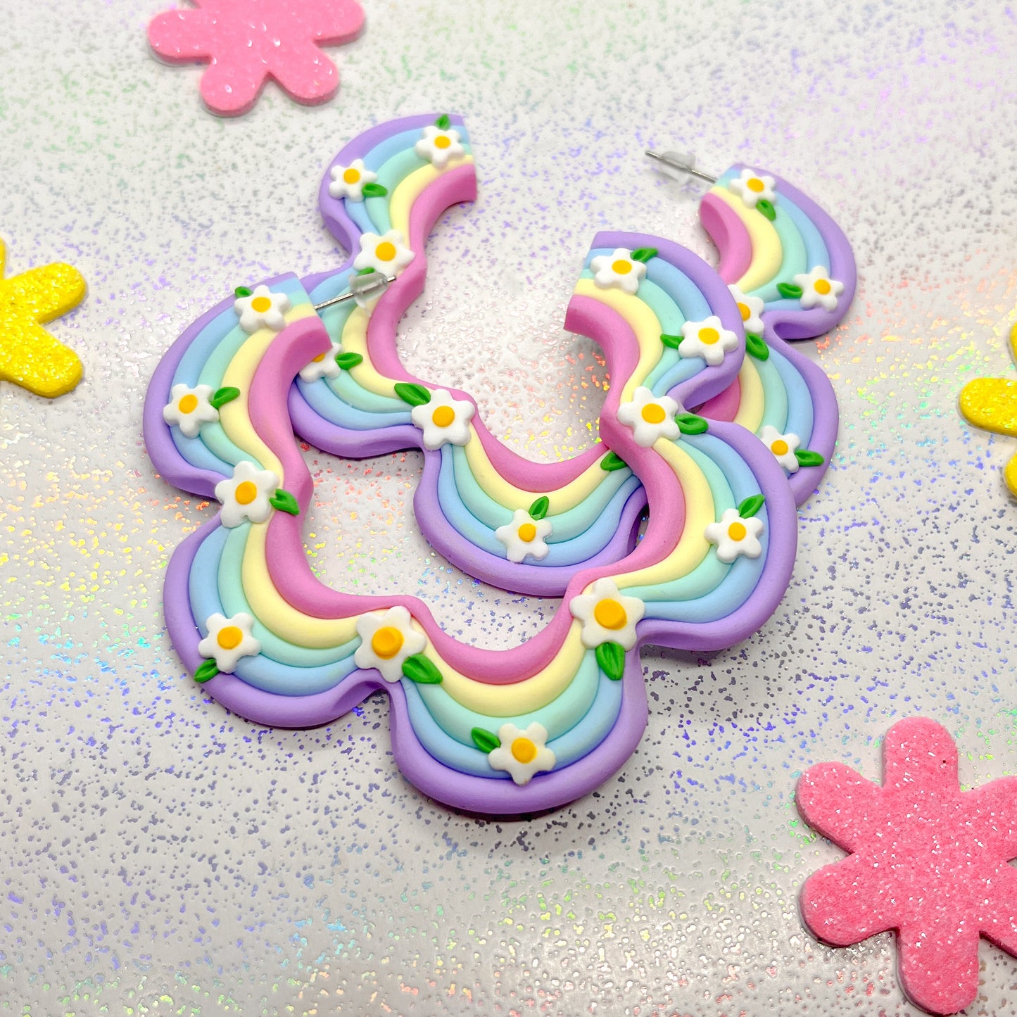 Pastel rainbow squiggle hoops with daisy details