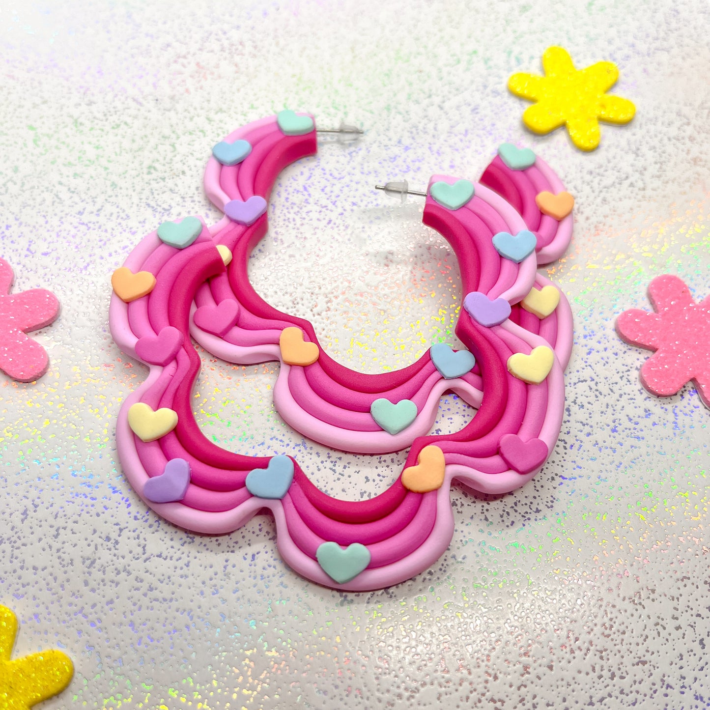 Pink ombre squiggle hoops with rainbow heart details