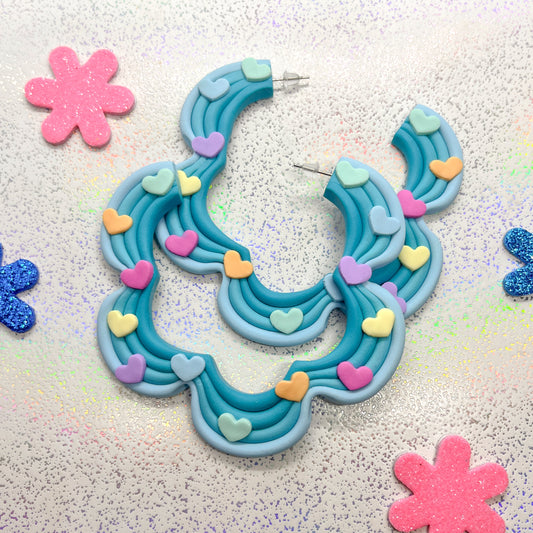 Blue ombre squiggle hoops with rainbow heart details