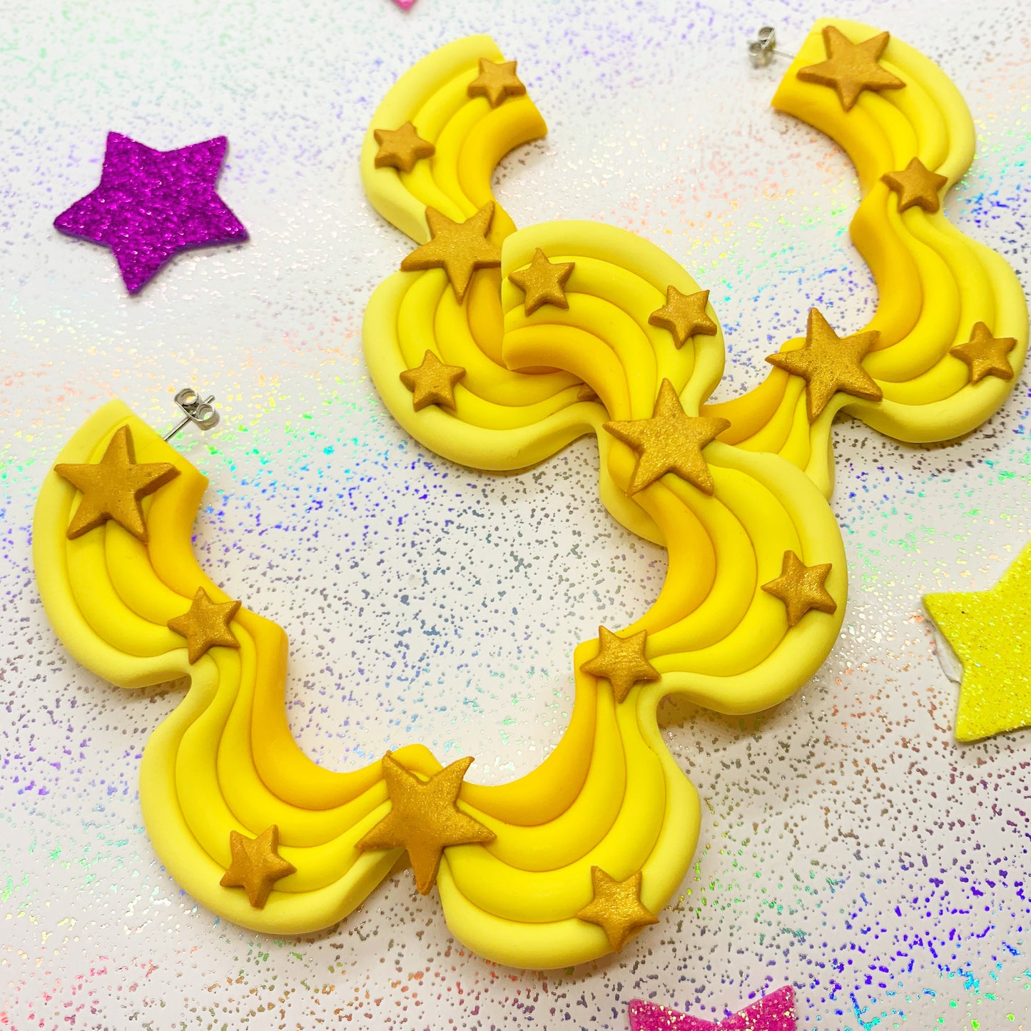 Yellow squiggle hoops with gold star details